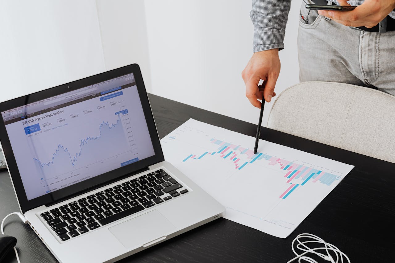 about-img Person analyzing cryptocurrency data using a laptop, highlighting financial insights.